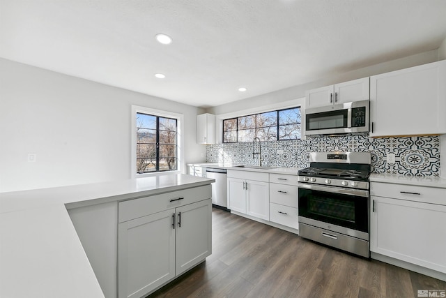 kitchen featuring white cabinets, sink, and stainless steel appliances