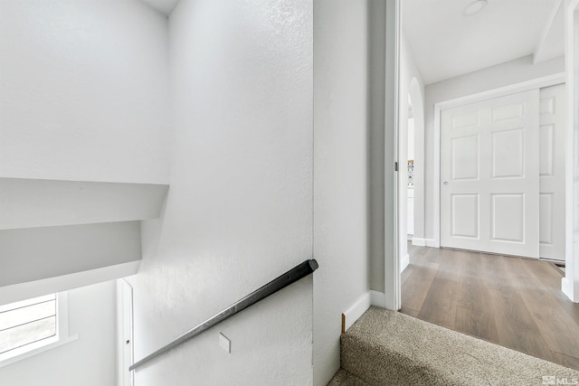 stairway with wood-type flooring