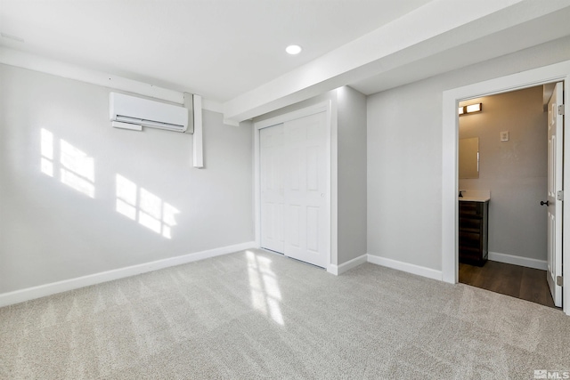 basement featuring dark carpet and a wall mounted AC