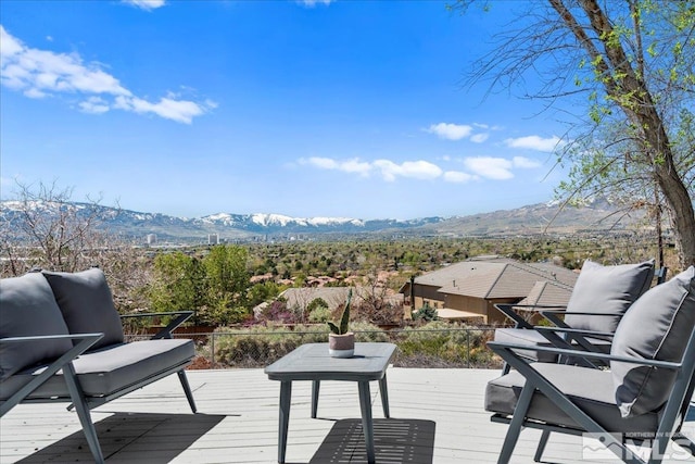 wooden deck featuring a mountain view