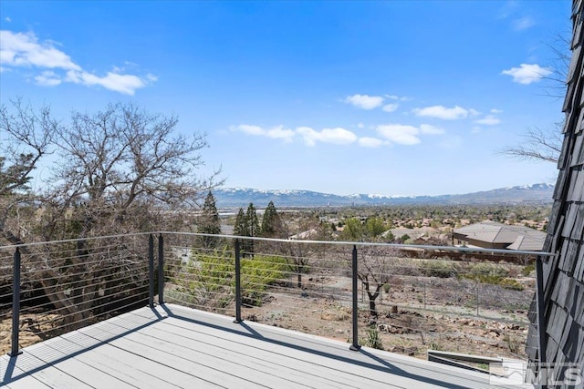 wooden deck with a mountain view