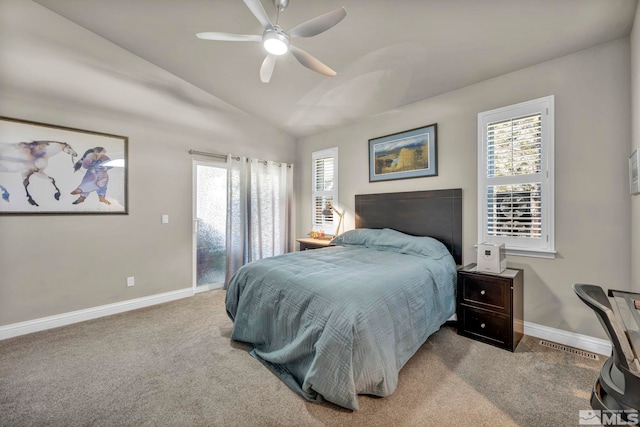 bedroom featuring ceiling fan, light colored carpet, and lofted ceiling