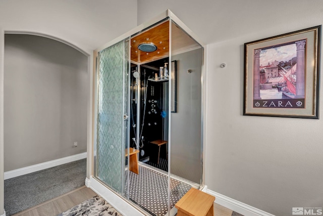 bathroom with hardwood / wood-style flooring