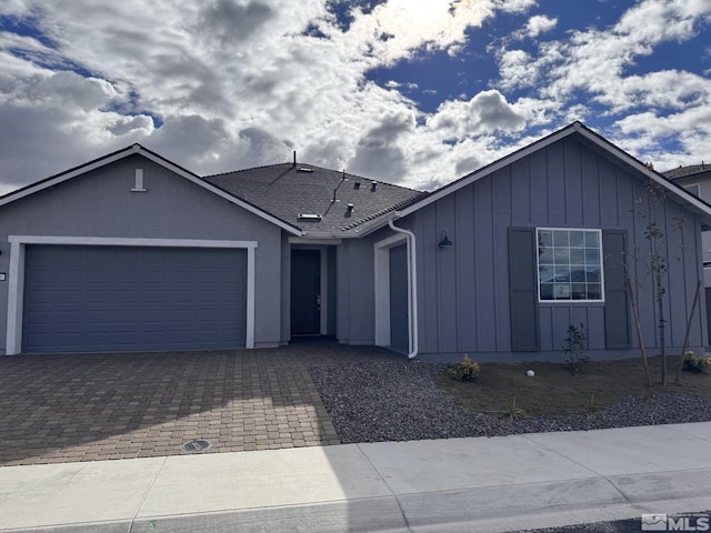 ranch-style home with a garage