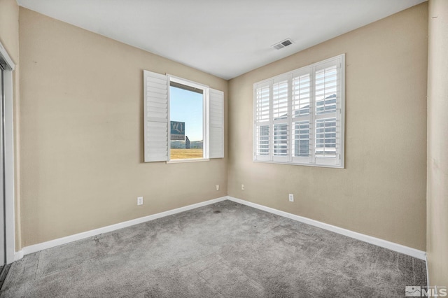 spare room featuring carpet flooring