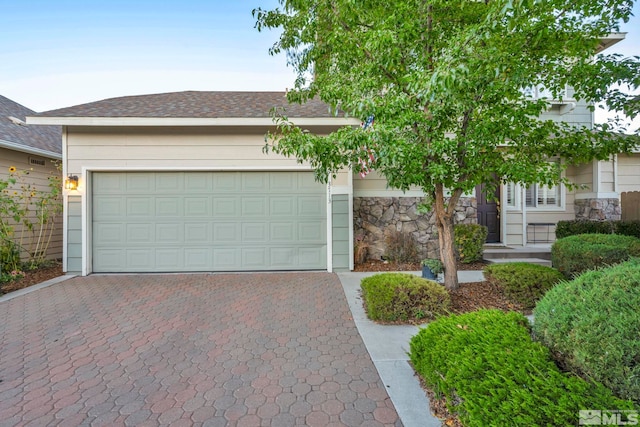 view of front of home with a garage