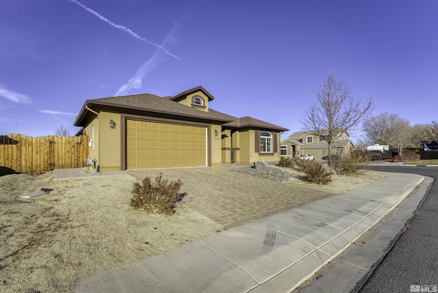 view of front of home with a garage