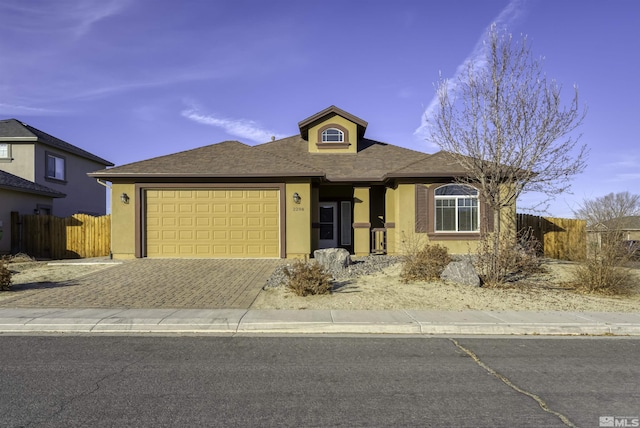 ranch-style home featuring a garage