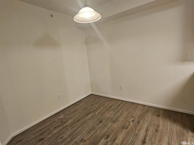 unfurnished room featuring dark hardwood / wood-style floors