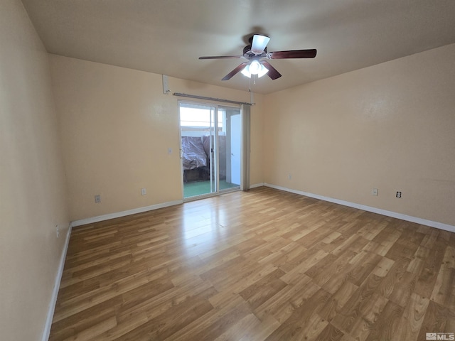 unfurnished room with ceiling fan and light wood-type flooring