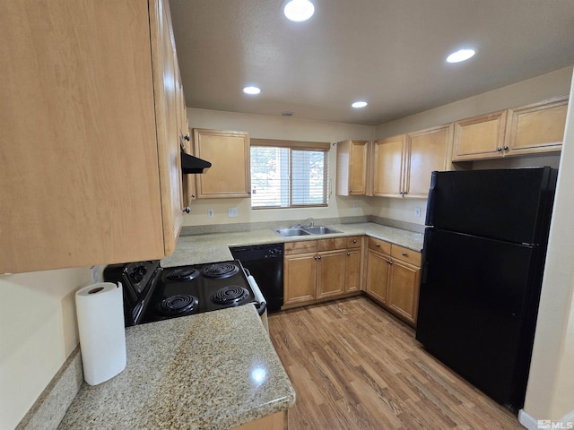 kitchen featuring black appliances, sink, light wood-type flooring, light brown cabinetry, and light stone counters