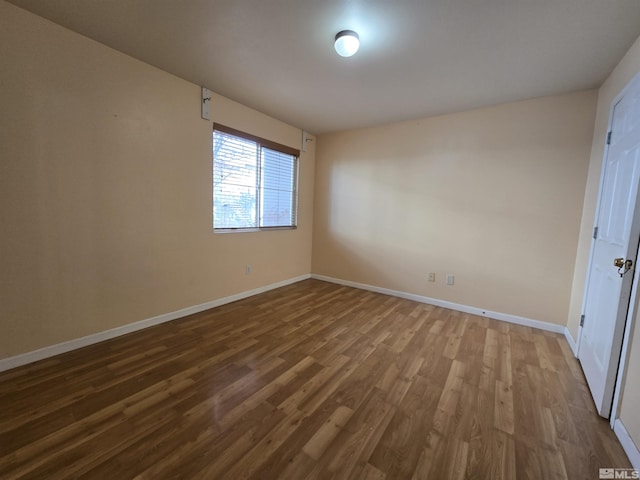 spare room featuring hardwood / wood-style flooring