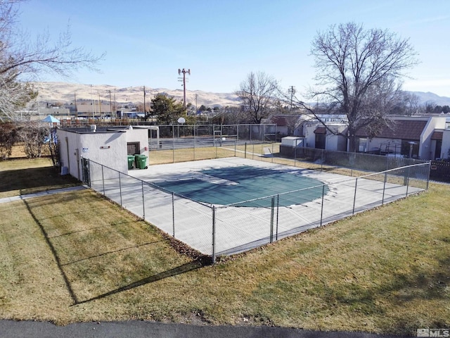 view of pool with a lawn, a mountain view, and a patio