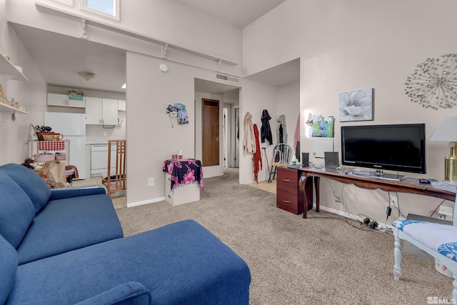 living room featuring light carpet