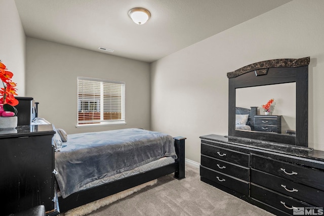 bedroom with light carpet