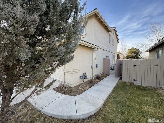 view of home's exterior with a yard