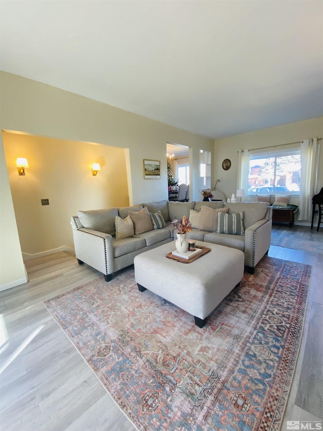 living room with light hardwood / wood-style flooring