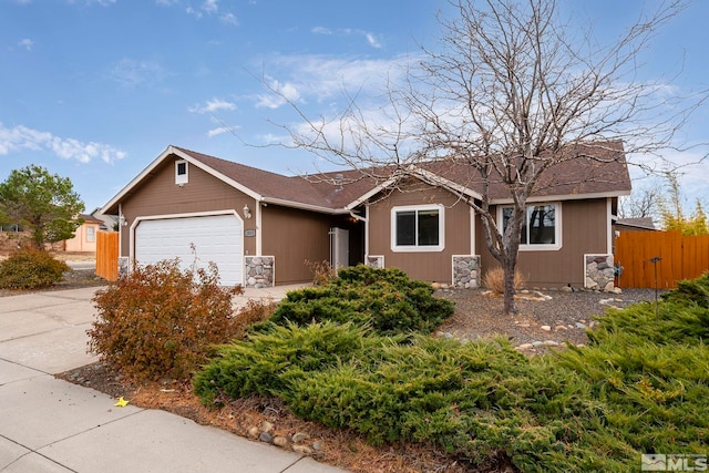 ranch-style house featuring a garage