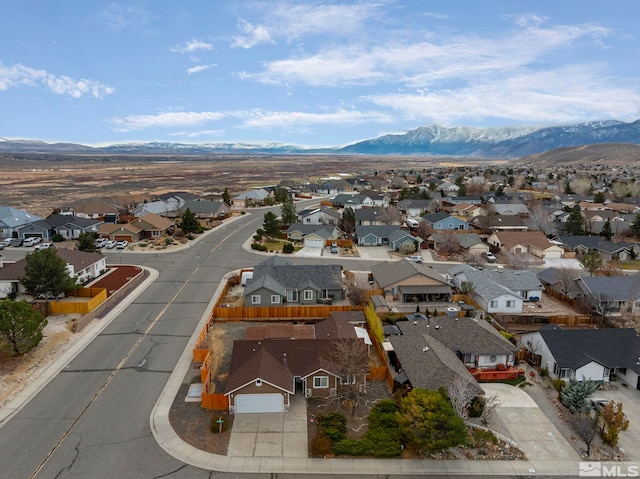 birds eye view of property with a mountain view