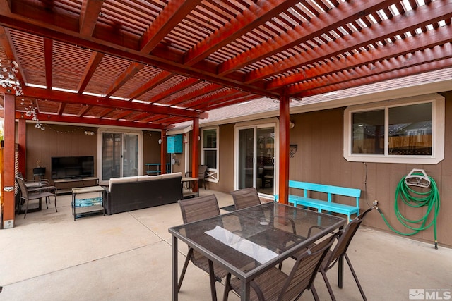 view of patio featuring an outdoor living space and a pergola