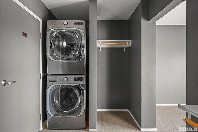 washroom with carpet flooring and stacked washer and clothes dryer