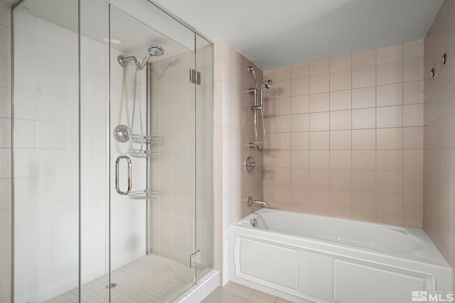 bathroom featuring tile patterned floors and independent shower and bath