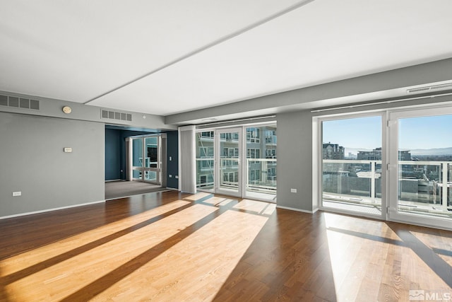 empty room with hardwood / wood-style floors