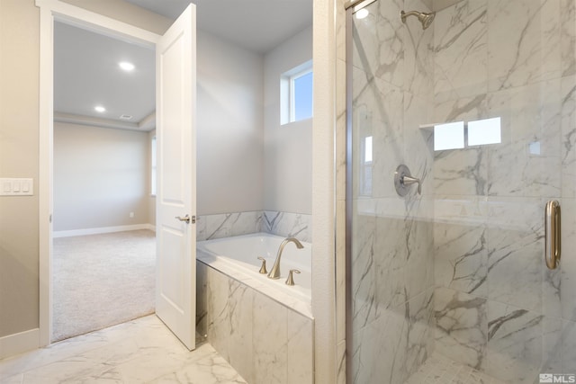 bathroom with shower with separate bathtub