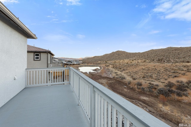 balcony featuring a mountain view