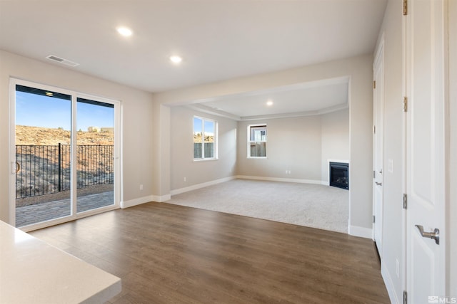 unfurnished living room featuring wood-type flooring