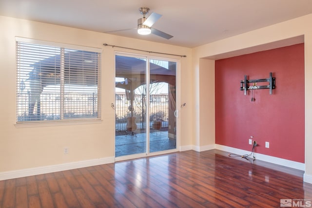 unfurnished room with hardwood / wood-style floors and ceiling fan