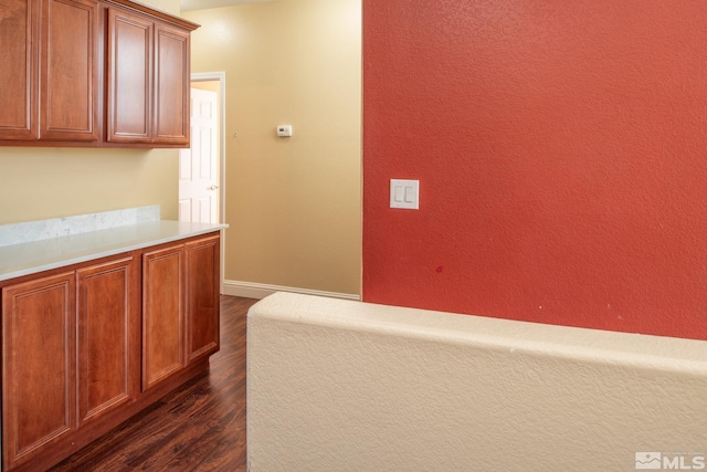 corridor with dark hardwood / wood-style floors