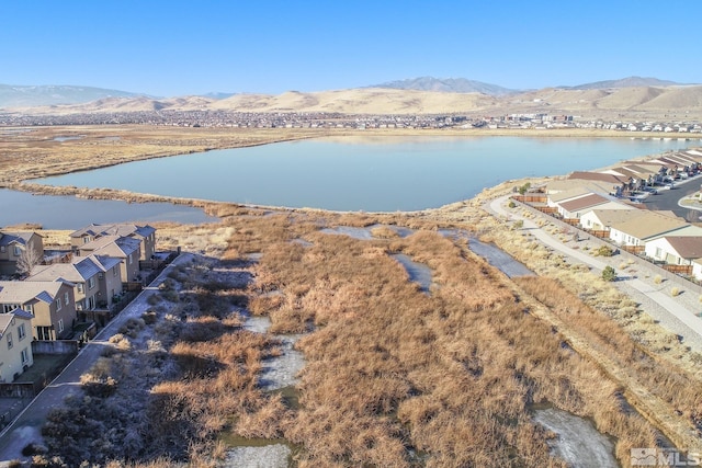 aerial view featuring a water and mountain view