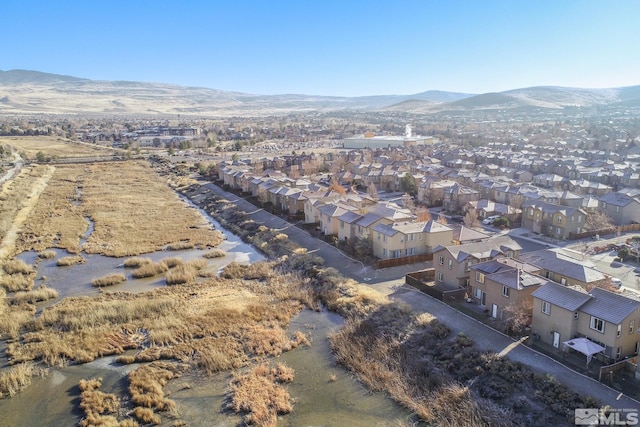 birds eye view of property with a mountain view