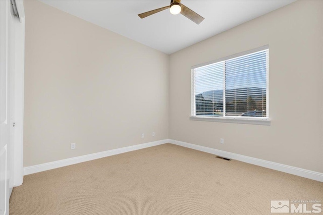 empty room with light carpet and ceiling fan