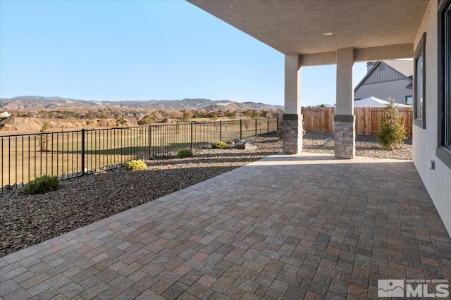 view of patio / terrace with a mountain view