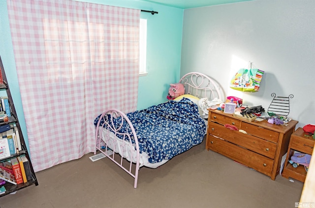 bedroom with concrete flooring