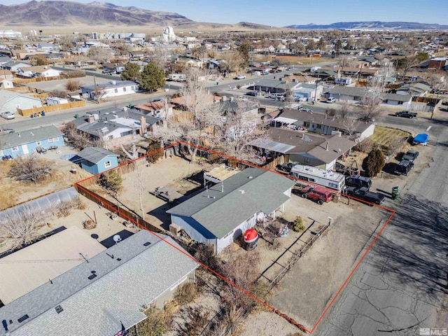 bird's eye view featuring a residential view and a mountain view