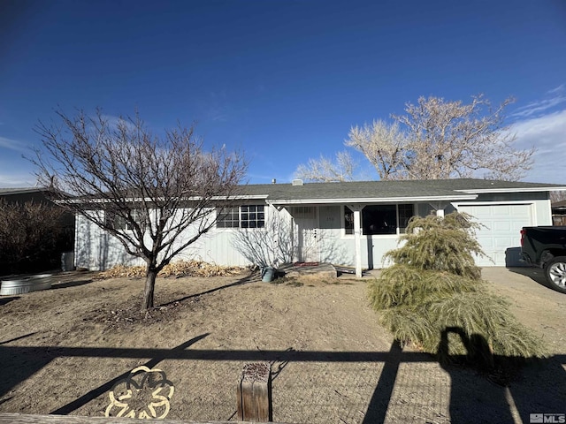 ranch-style home featuring an attached garage