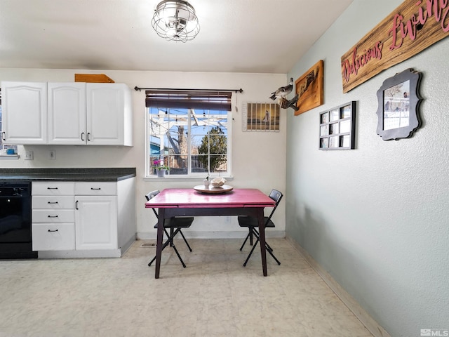 dining room with light floors and baseboards