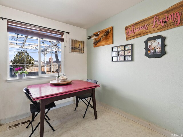 dining room with visible vents, baseboards, and tile patterned floors