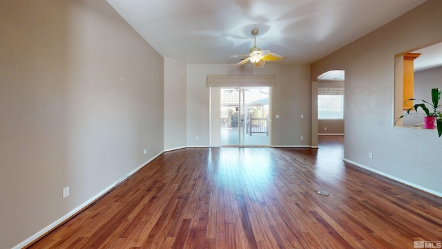 spare room with ceiling fan and wood-type flooring