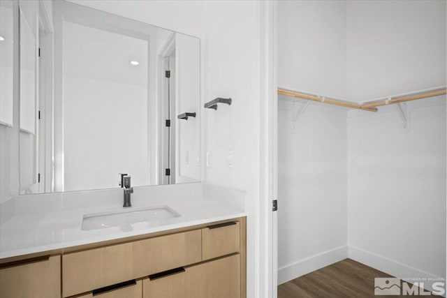 bathroom featuring hardwood / wood-style floors and vanity