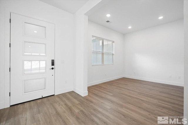 entryway with light hardwood / wood-style floors and a wealth of natural light