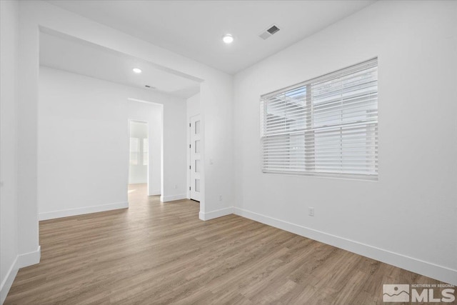 unfurnished room featuring light hardwood / wood-style flooring