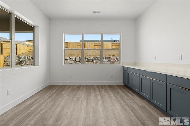 unfurnished room featuring light wood-type flooring