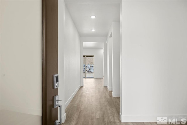 hall with light hardwood / wood-style floors