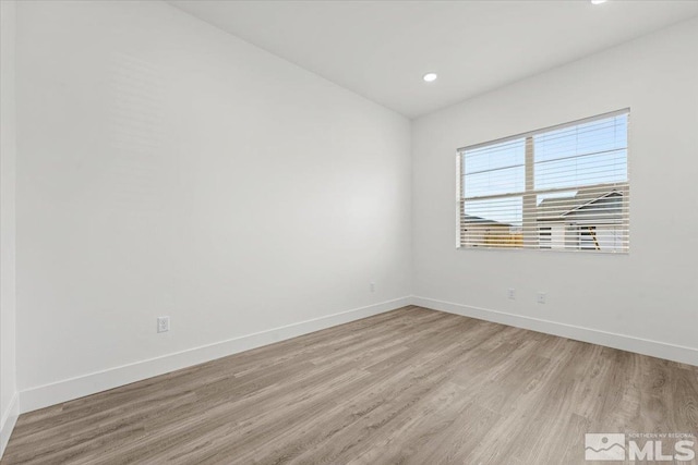 unfurnished room featuring light wood-type flooring