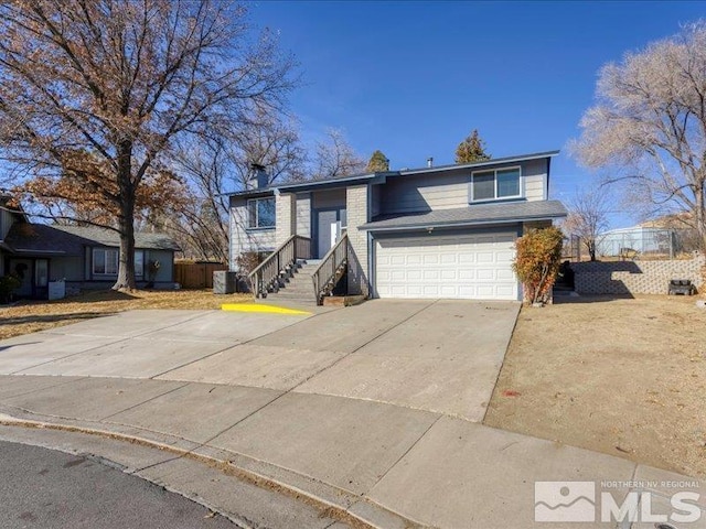 split level home featuring a garage and central AC