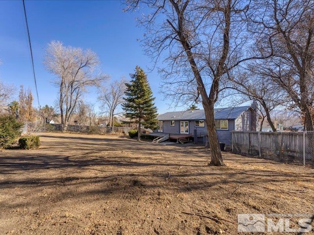 view of yard featuring a wooden deck